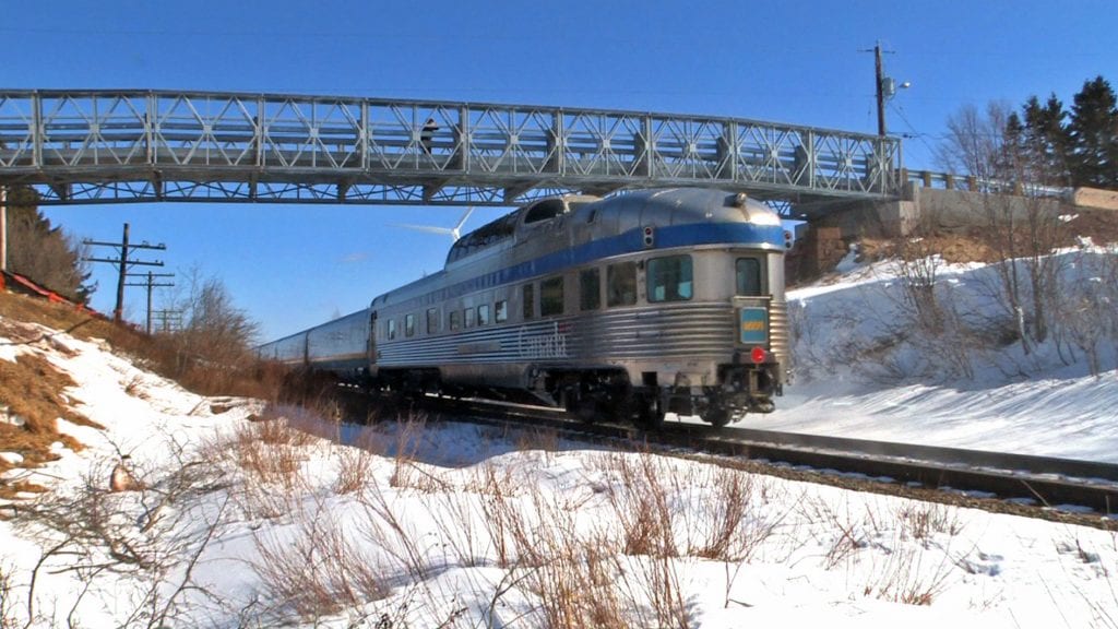 Passenger train passing under Algonquin Modular Panel Bridge