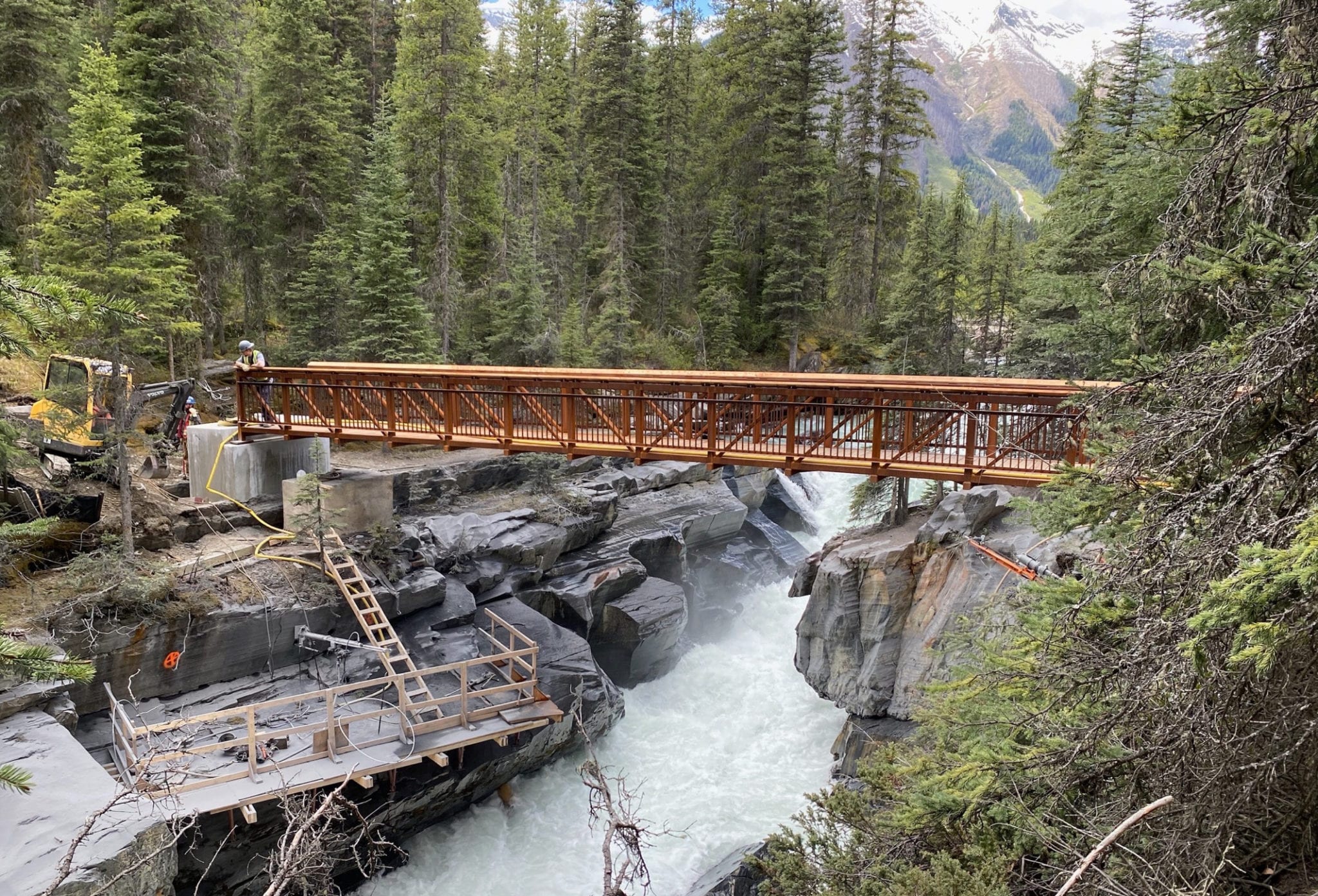 Prefabricated hiking trail bridge over mountain gorge 