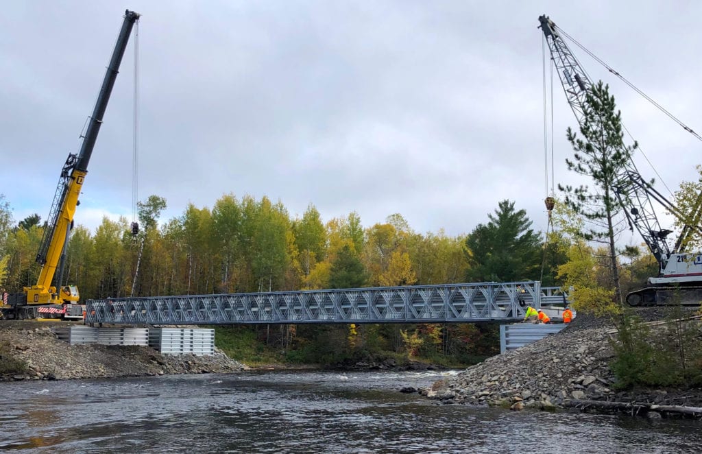 Wide view of Bailey Bridge and abutments package installation