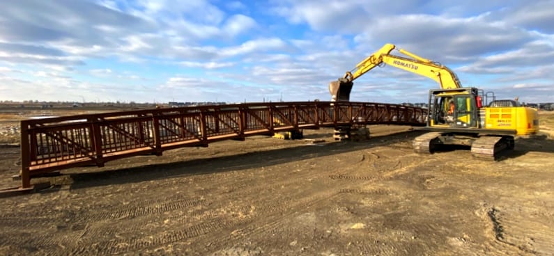 Wide view of prefabricated pedestrian bridge sections joined