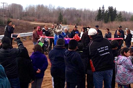 ribbon-cutting ceremony opening new steel girder bridge