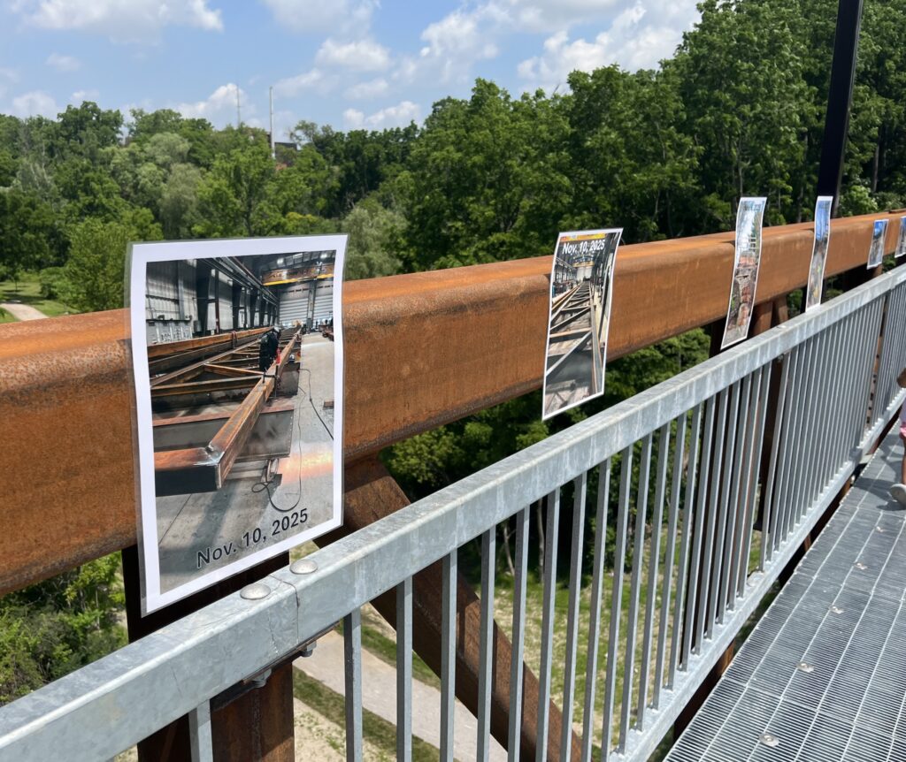 Photo display at prefabricated pedestrian bridge official opening